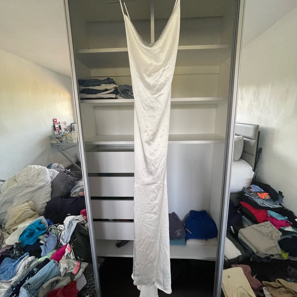 Gorgeous long white dress! Never worn and super flattering!